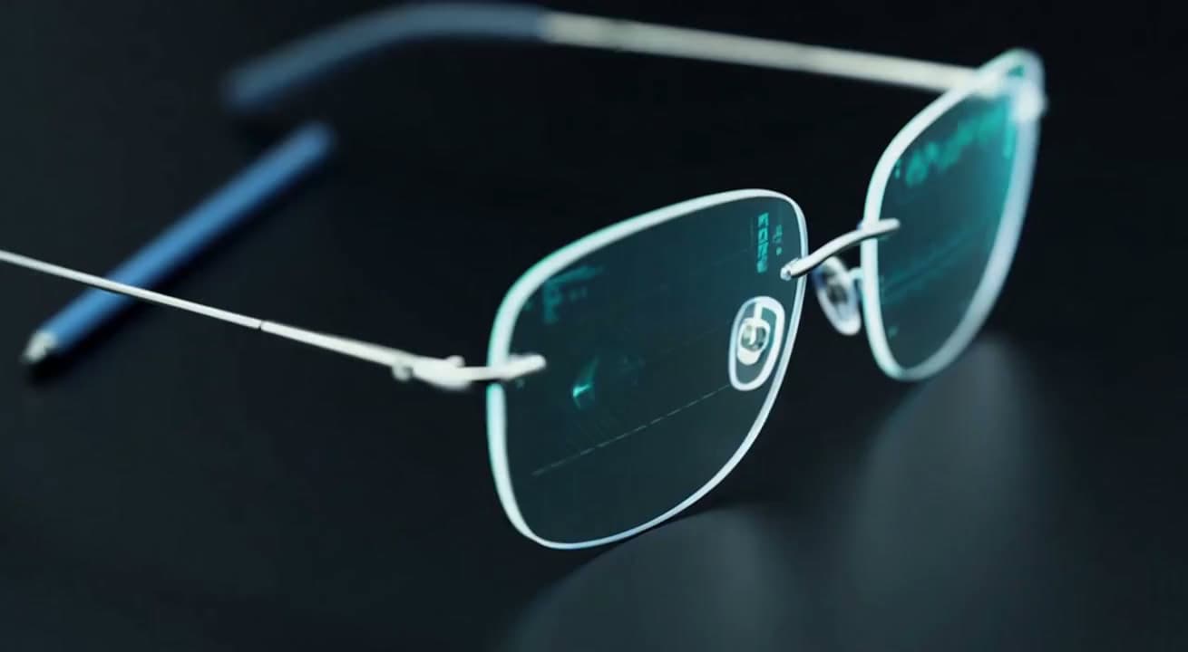 Macro view of the rimless lens on a dark surface, faint interface projections visible in the glass